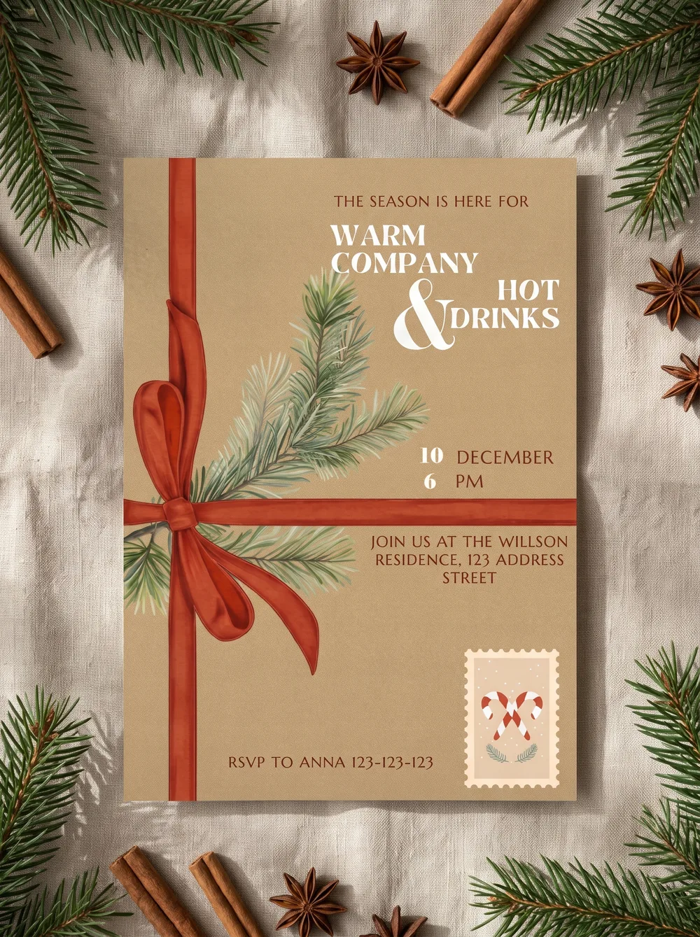 The printed Warm Company invitation on rumpled cream linen, among pine sprigs, cinnamon sticks, star anise and pine cones